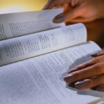 Student Reading a Textbook